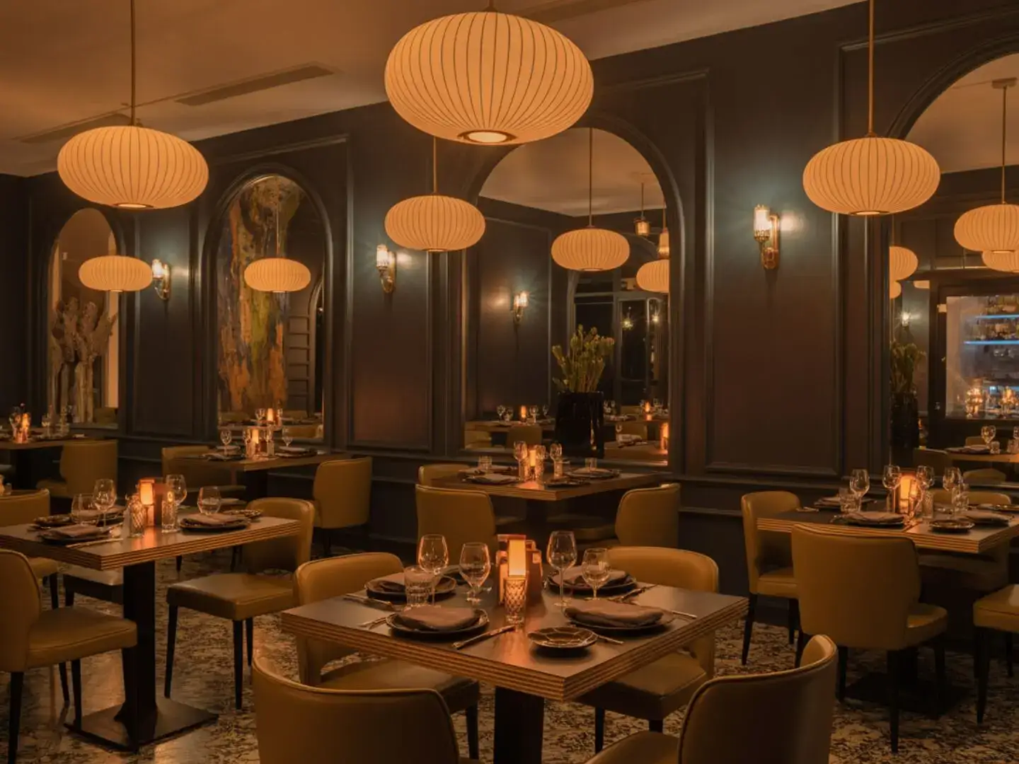 Elegant main dining room at Carnys with Mediterranean decor and intimate table settings